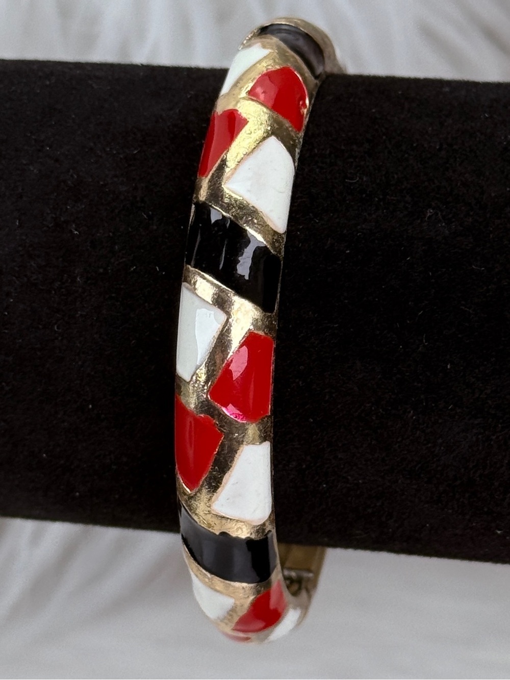 Vintage goldtone, red white black enamel, hinged bangle bracelet
